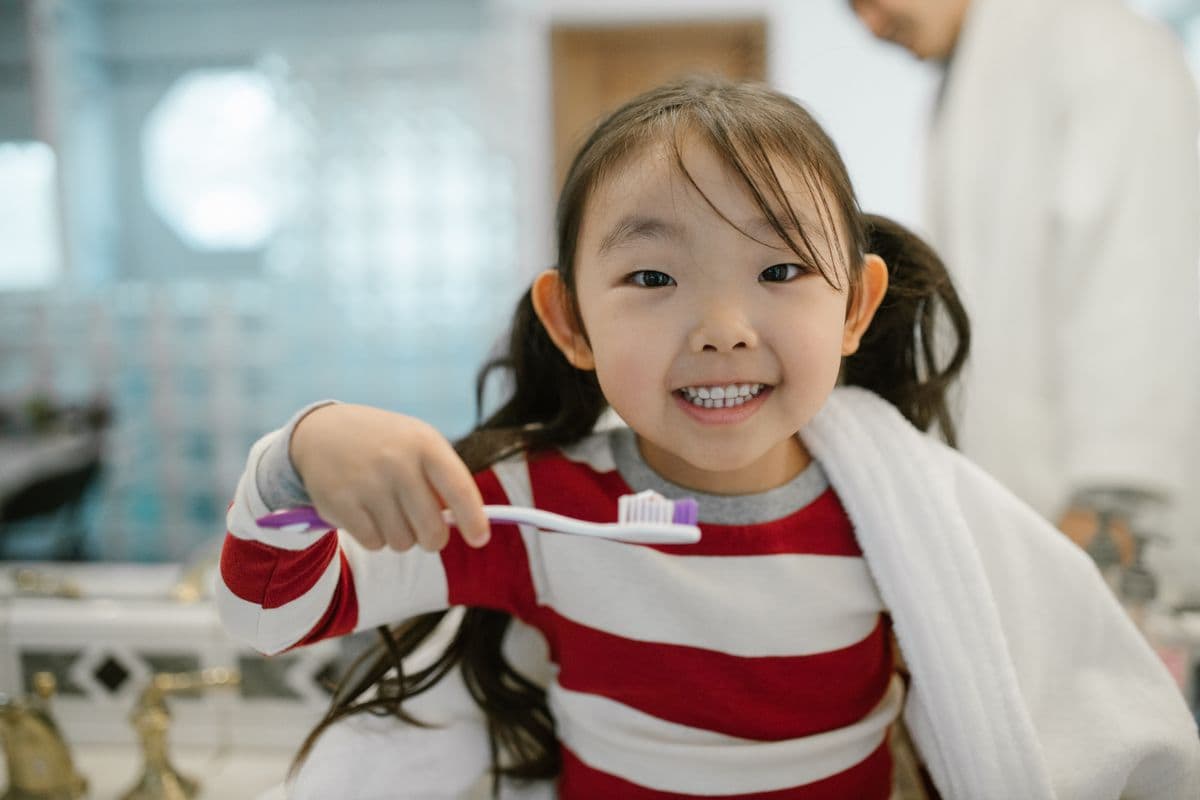 A child smiling in soft natural light