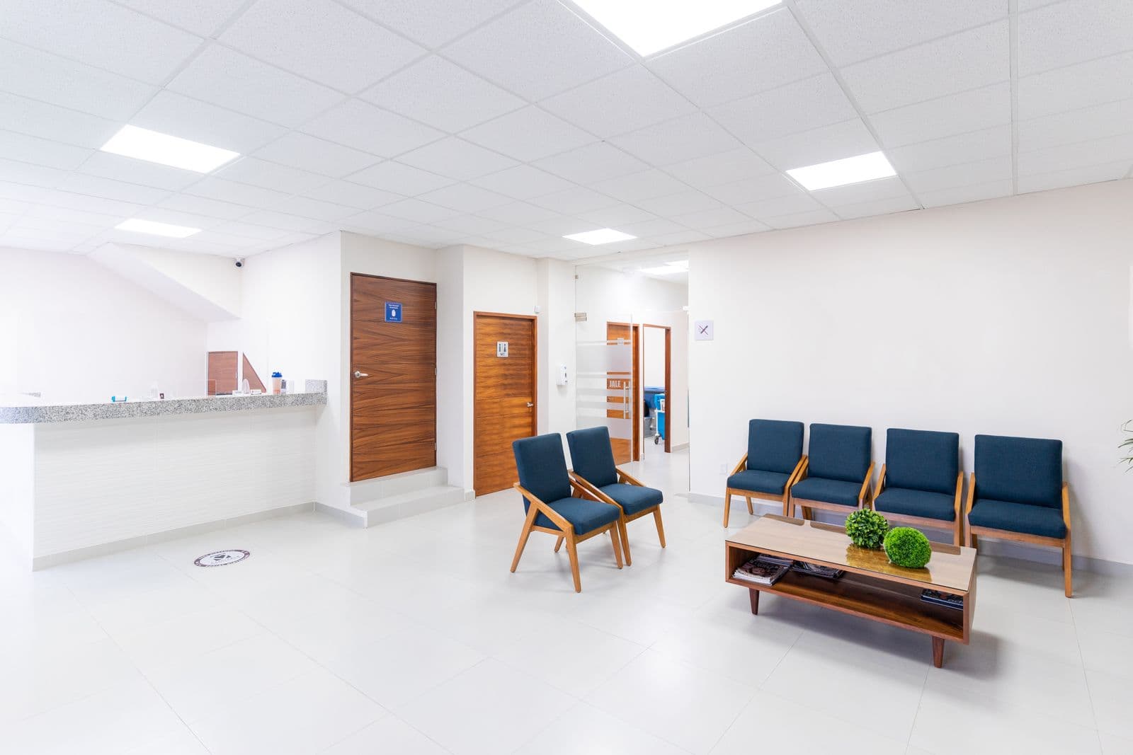 A bright, modern clinic waiting area with comfortable seating